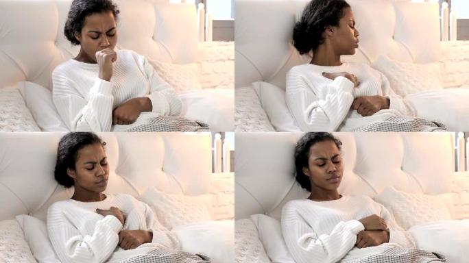 生病的年轻非洲妇女在床上放松时咳嗽