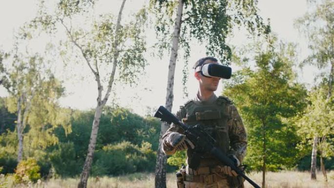 带着步枪戴着虚拟现实眼镜的士兵在户外