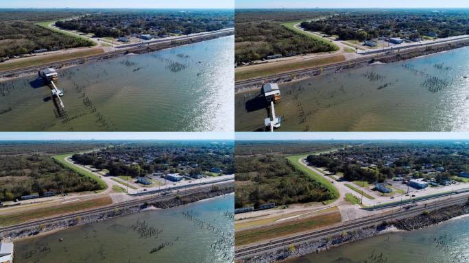 美国路易斯安那州新奥尔良庞恰特雷恩湖畔的码头和铁路。带有前向摄像机运动的空中无人机视频。