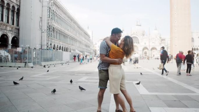 年轻的亚洲成年夫妇在意大利威尼斯接吻和拥抱