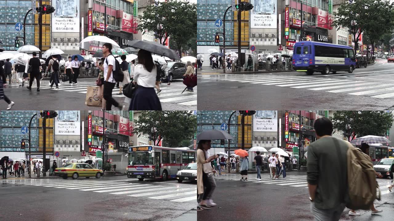日本繁忙的行人和汽车穿越-时间流逝的雨季