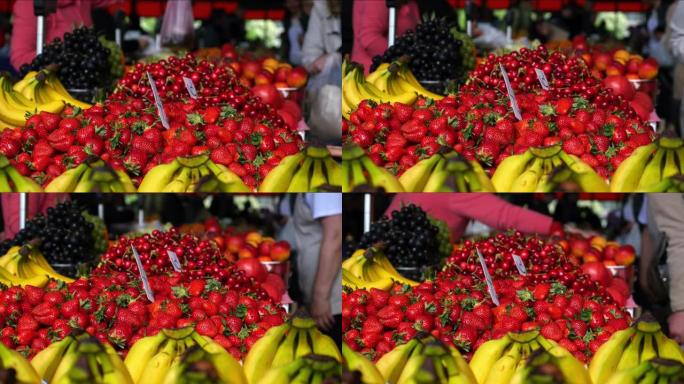 在市场上漂亮的新鲜水果，买主把钱给卖主买的一些水果