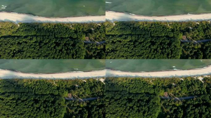 从上面看视频，鸟瞰一个美丽的野生岛屿。鸟瞰图。4K UHD。在沿海野外乘坐无人机飞行。史诗般的观点。