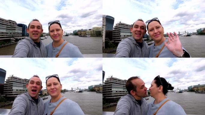 情侣以4k慢动作60fps的速度自拍泰晤士河和伦敦碎片摩天大楼