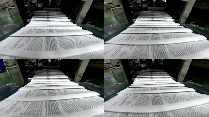 胶印机上的传送带，出版社的报纸