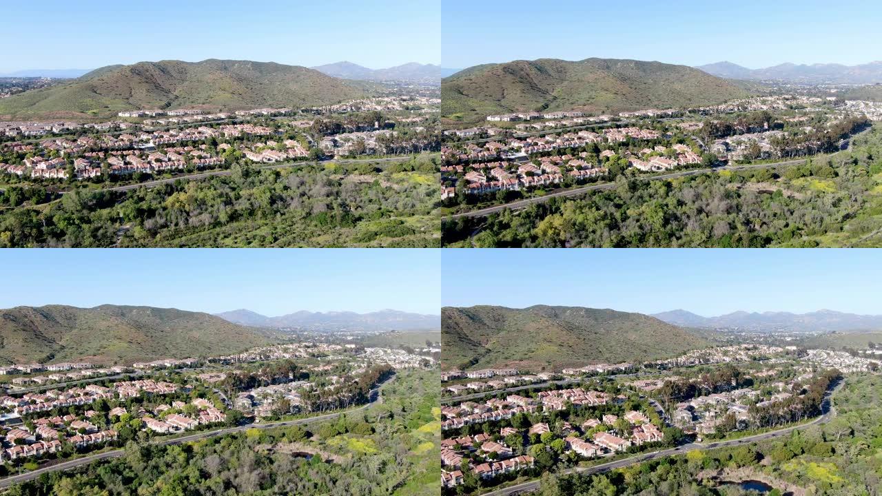 鸟瞰图郊区社区，山谷中彼此相邻的相同别墅。美国加利福尼亚州圣地亚哥。
