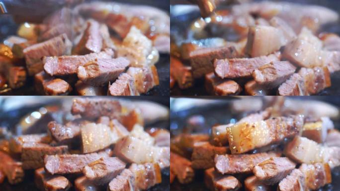 韩国餐厅用剪刀切煎熟黑猪肉餐，新鲜美味的韩国美食，特写，复制空间，生活方式