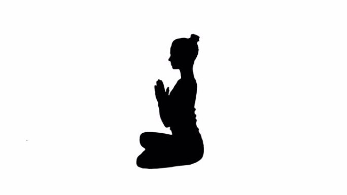 剪影年轻白人金发女子练习瑜伽