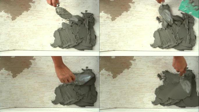 俯视图: 将水泥放在地板上作为瓷砖粘合剂