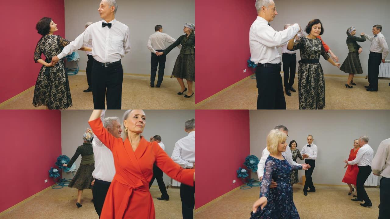 欢快的高级夫妇在舞蹈俱乐部跳华尔兹舞。成熟的男人和女人在娱乐俱乐部的舞蹈晚会上表演华尔兹。老年人活动