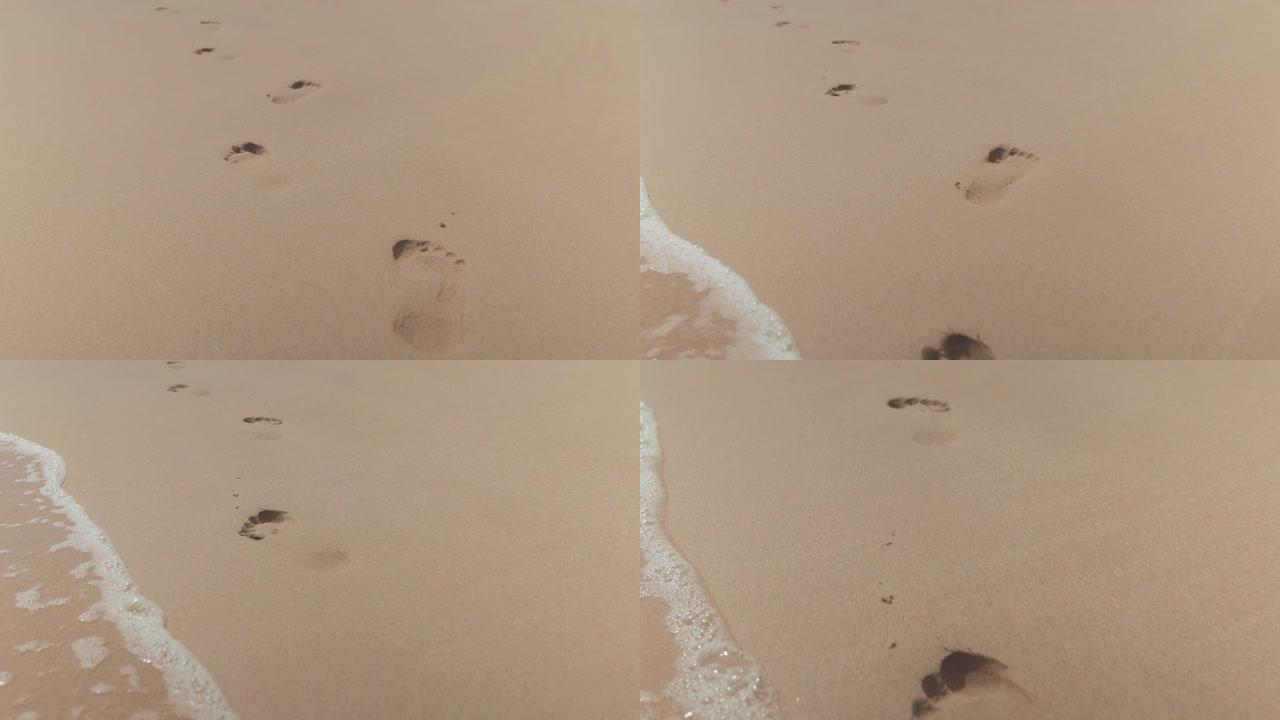 人类脚印在沙滩上的脚印