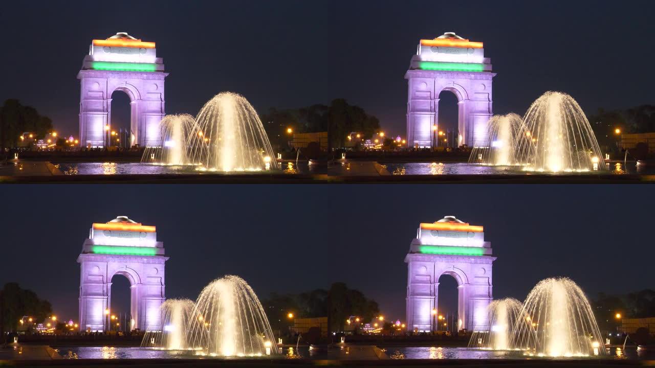 一个喷泉和印度门在晚上在新德里，印度的特写