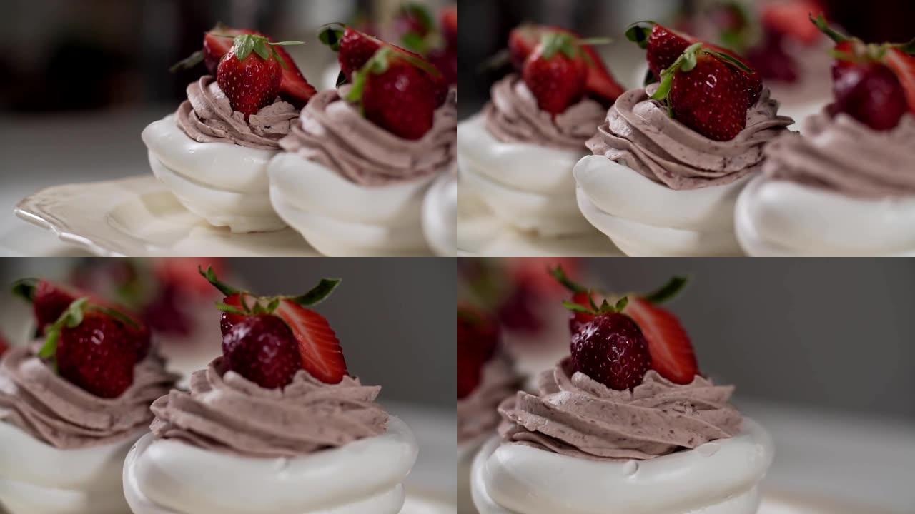 帕夫洛娃的甜点配奶油和草莓。相机向右滑动