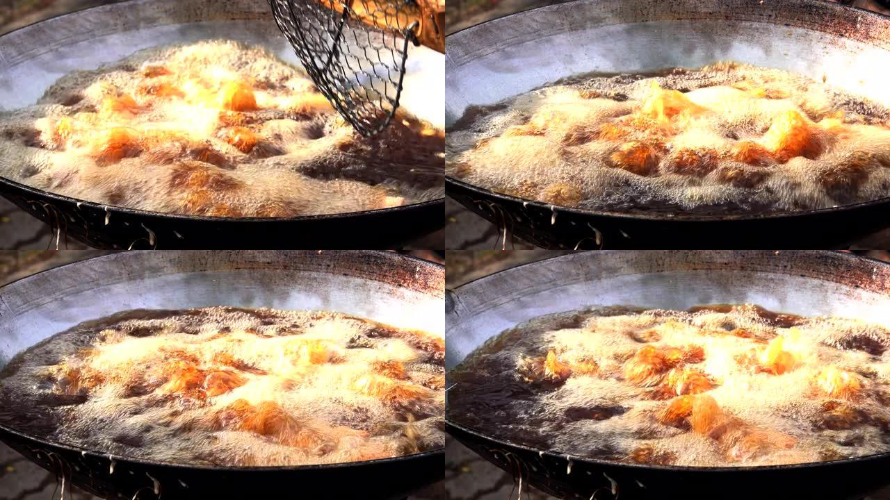 用沸腾的油在旧锅中炸鱼