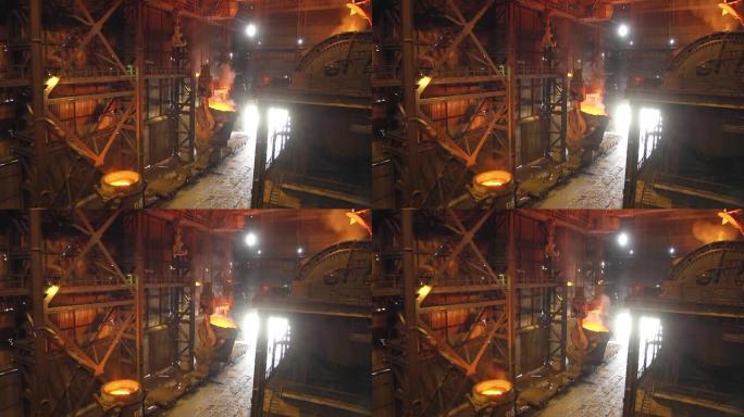 将铁倒入转炉的过程。冶金厂的钢铁生产。