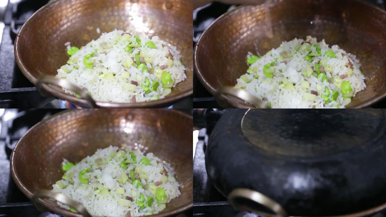 厨师用平底锅烹饪蔬菜炒饭