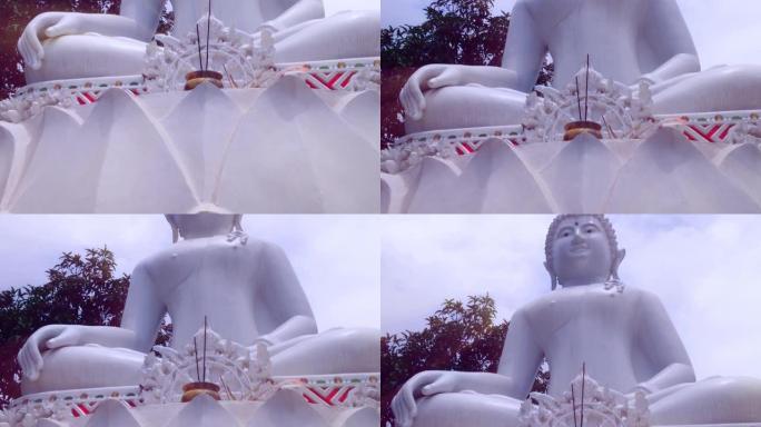 佛寺花园大白佛像的摄像机运动从底到顶视图