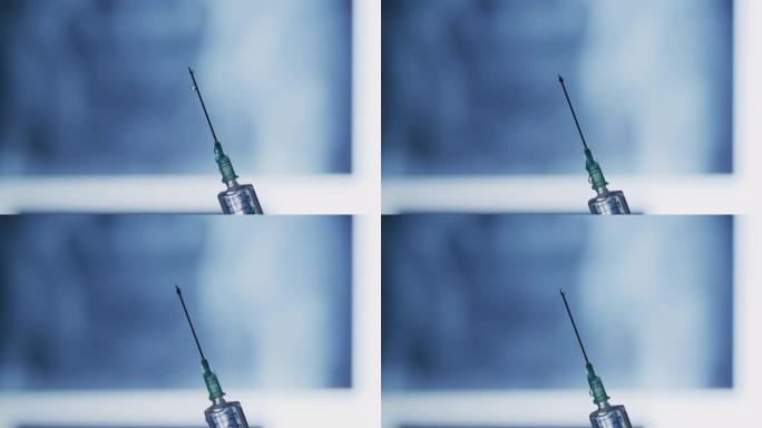 从注射器针头上掉落的液滴