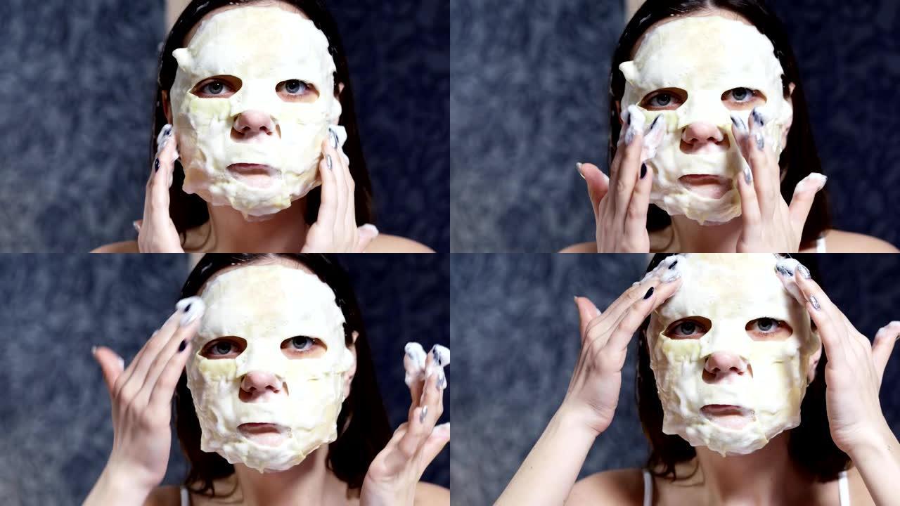 女人在脸上涂化妆品泡沫面膜，看着相机，护肤概念