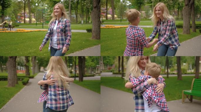 家庭休闲妈妈儿子遇见拥抱公园散步