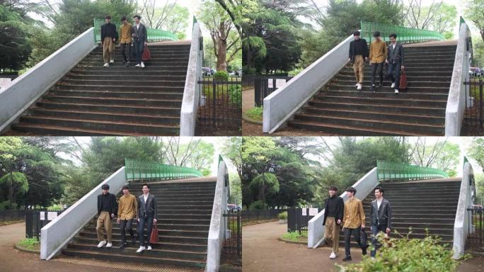 年轻的日本男性朋友在东京公园散步
