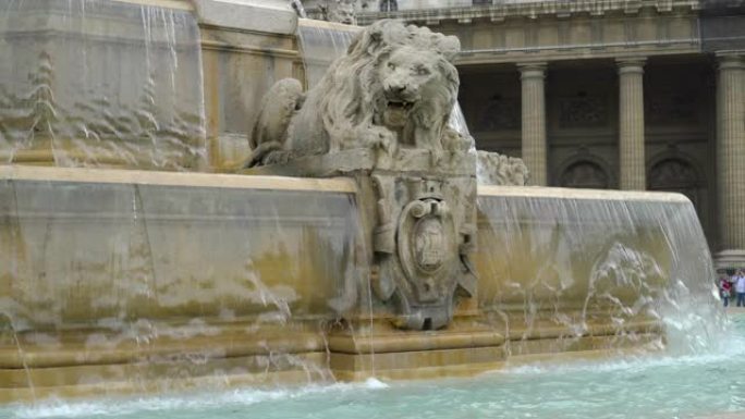 狮子雕塑和喷泉的景色