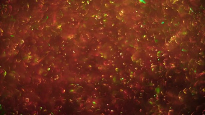 抽象闪光红金背景，气泡混沌运动。球旋转，抽象分子布朗运动。