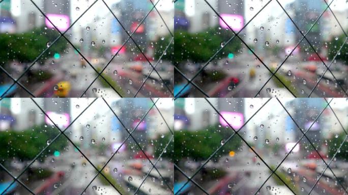 东京涩谷十字路口的窗户上有雨滴
