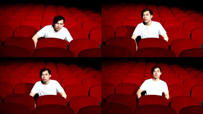 一个人独自坐在空荡荡的电影院或剧院里