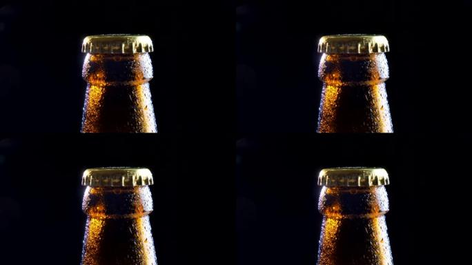 背景隔离在黑色上的闪亮啤酒瓶盖特写镜头