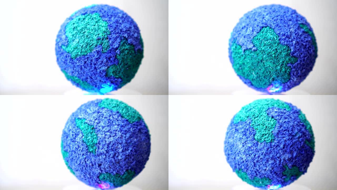 创建模型纸工艺地球地球仪的旋转，在灰色背景上旋转世界全球生态。4k创建的循环