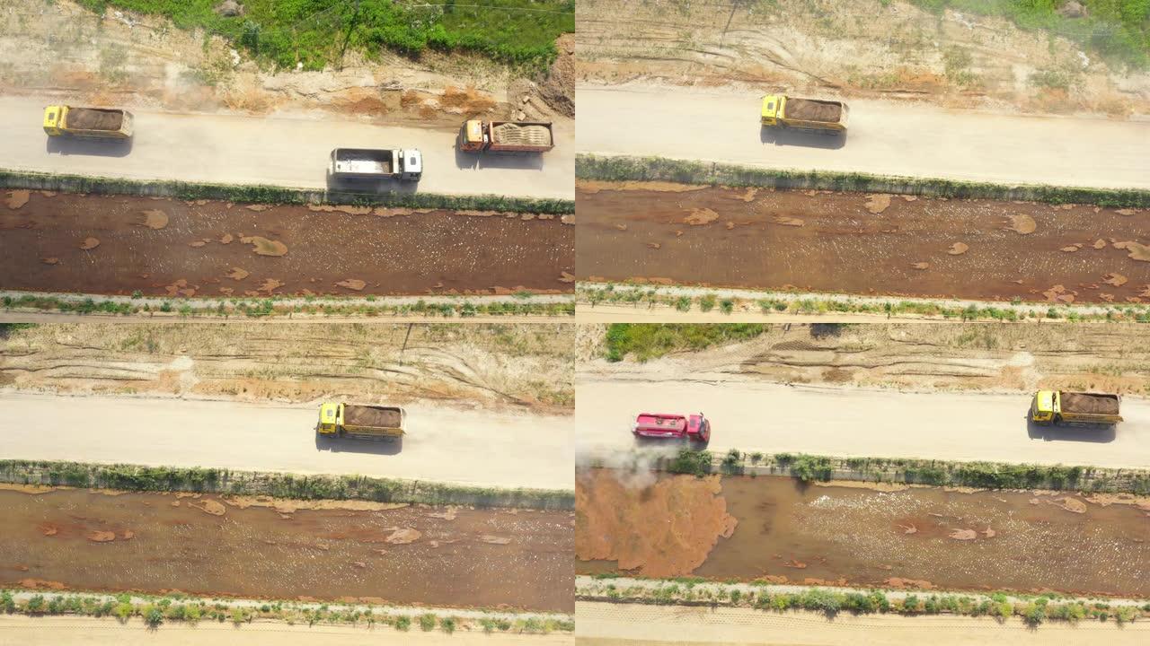 半卡车在沙滩上行驶的Tod向下视图。在建筑工地上。鸟瞰图