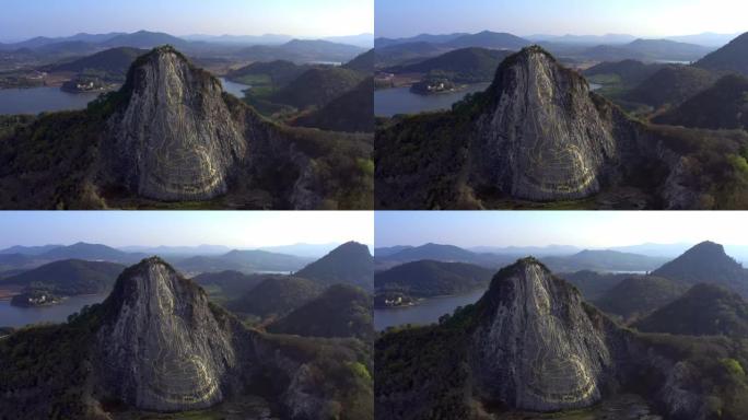 泰国芭堤雅-2019年5月18日: 画在悬崖上的大金佛。巨大的图纸。鸟瞰图。
