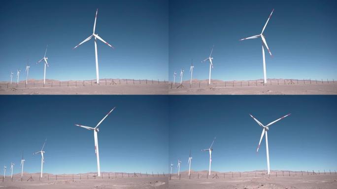 美丽阳光明媚的夏季陆地上的风力涡轮机。