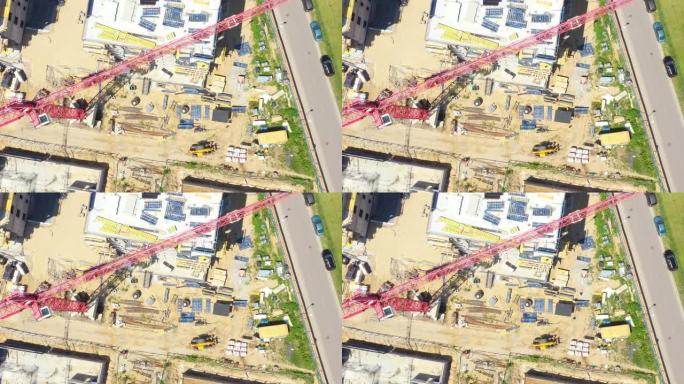 建筑工地背景。起重起重机和新多层建筑。工业背景。Aeria视图