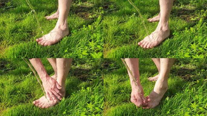 在草地上用水洗脚慢动作。