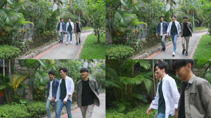 一群年轻的亚洲男子在公园散步