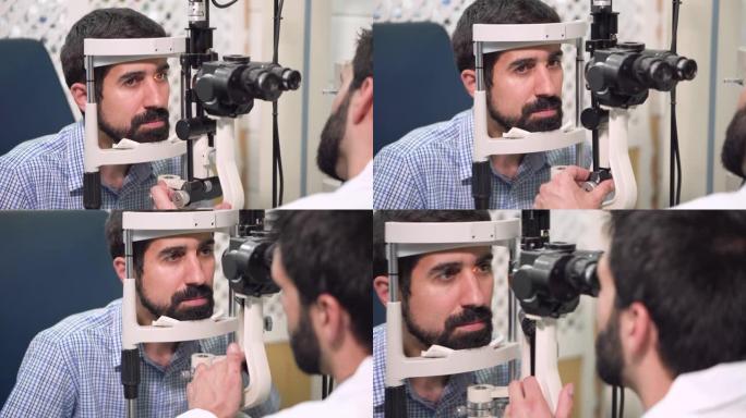 眼科医生在眼科诊所检查年轻人的视力-患者。