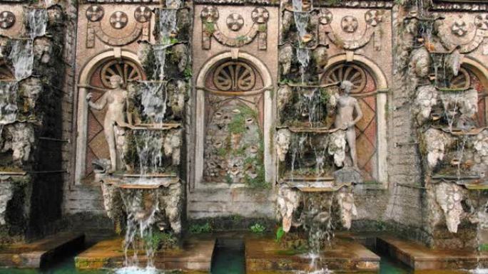 德国汉诺威。美丽不寻常的喀斯喀特瀑布喷泉。水倒入石碗中的地板。石头上的艺术。周围有雕像。慢动作。垂直