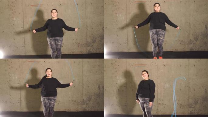 健身房里的胖女孩用跳绳工作