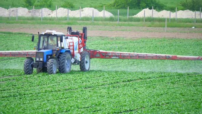 在工业种植上向农业植物喷洒肥料或化学药品。