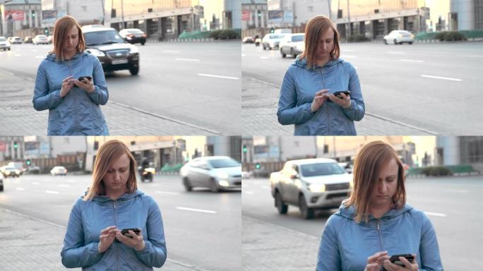 一名中年妇女正在人行道上行走，在智能手机中阅读消息。