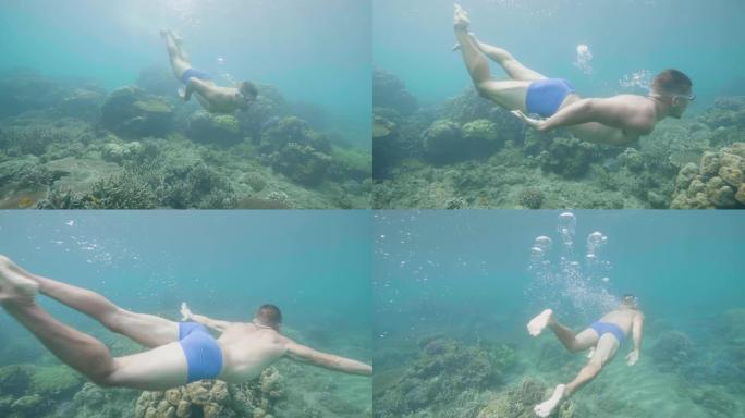 年轻人在美丽的海洋中浮潜，看着水下的热带鱼和珊瑚礁。