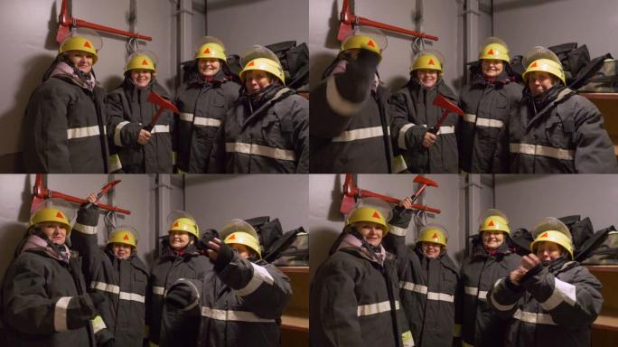 四名微笑的女消防员在消防局。