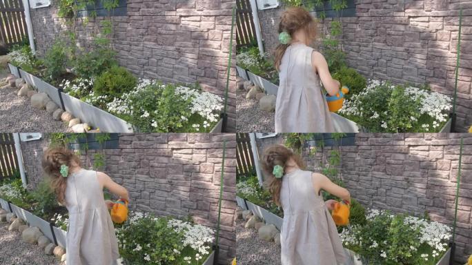 夏天的女孩用浇水罐浇花