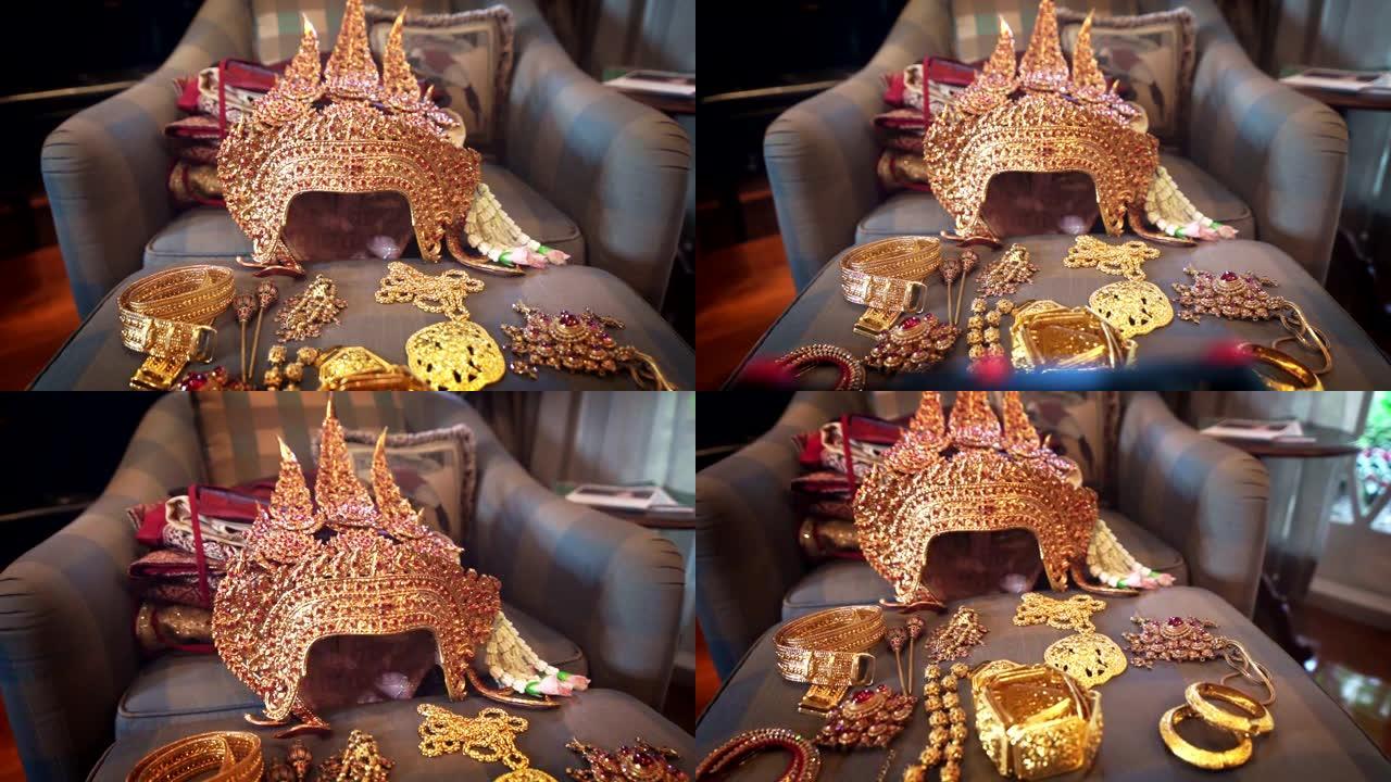 多莉用泰国传统戏剧女演员的宝石拍摄了古代金冠相机和配饰。