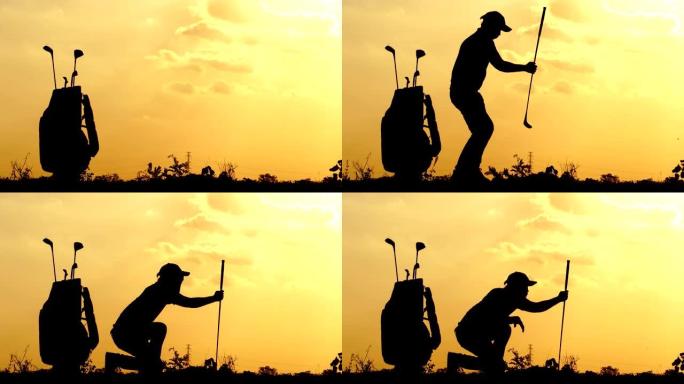 剪影男高尔夫球手在太阳落山的外面练习