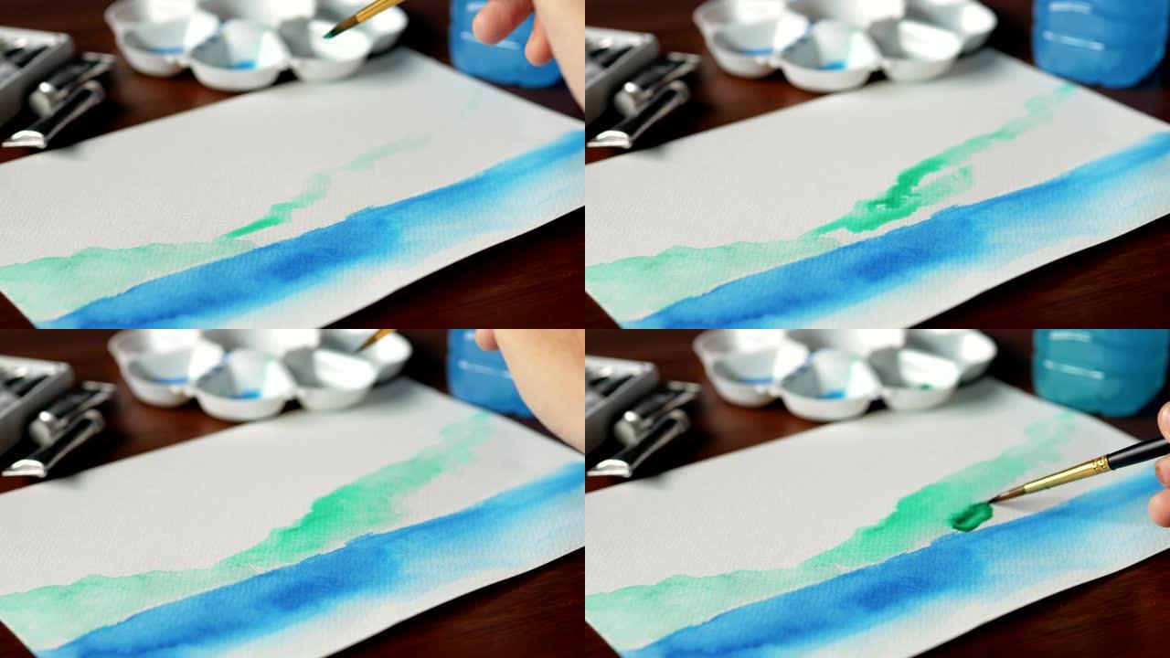艺术家在纸上画水彩