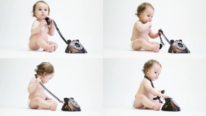 玩旧电话的婴儿