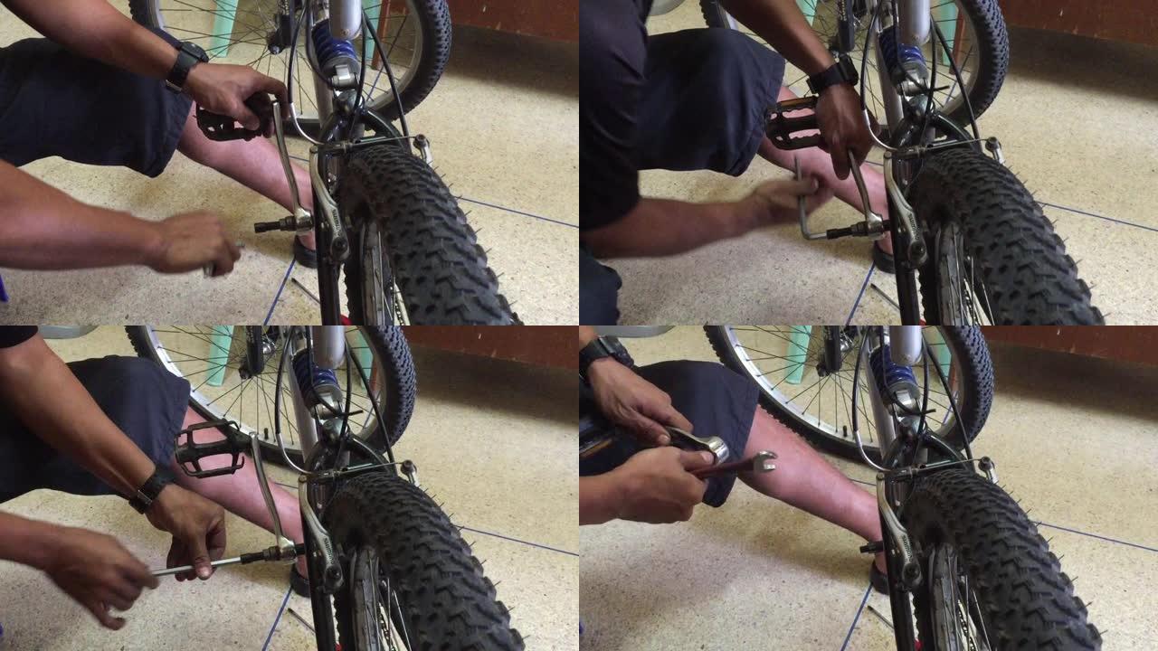 一名身份不明的自行车机械师修理自行车